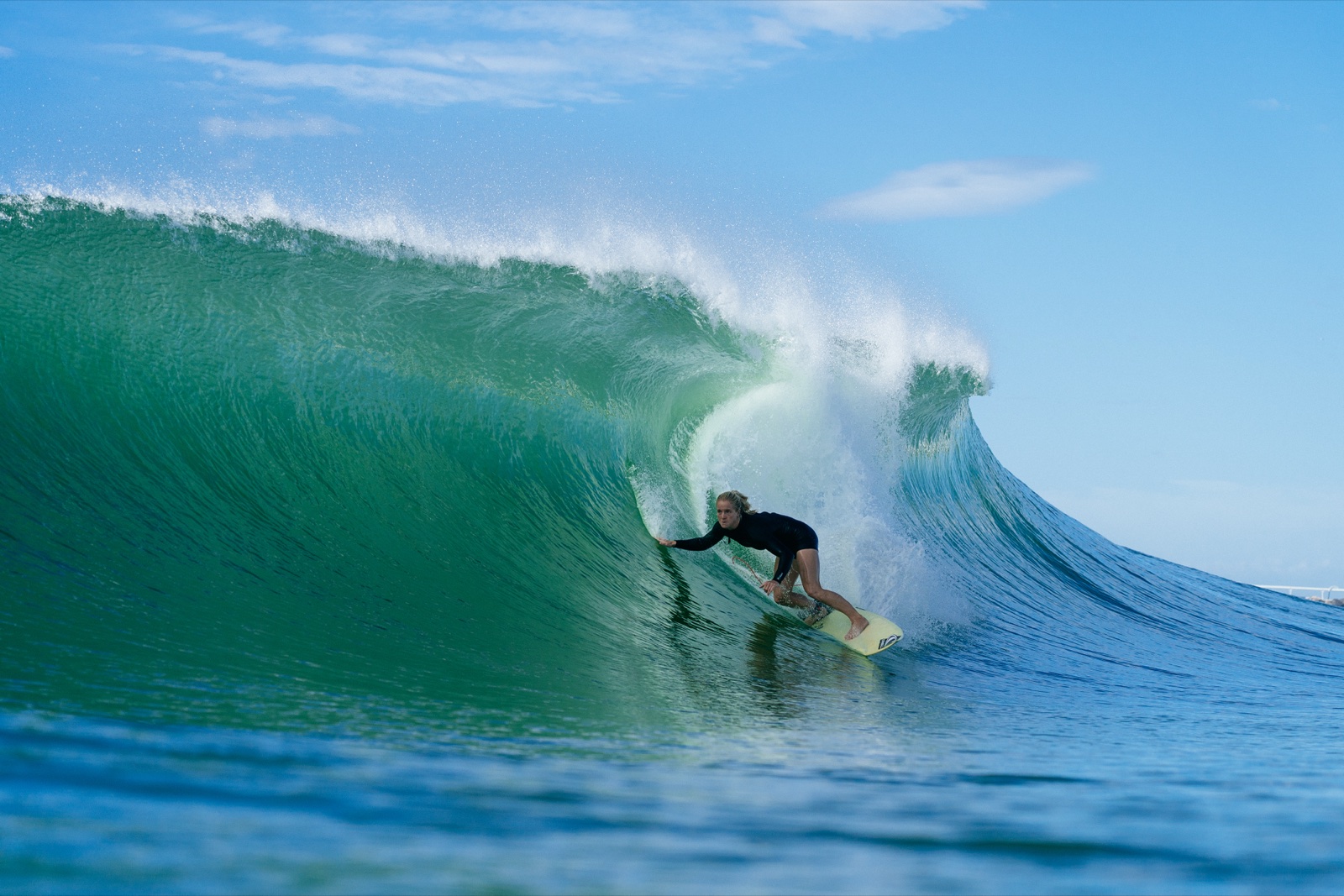 Sophie McCulloch surfing a green barrel